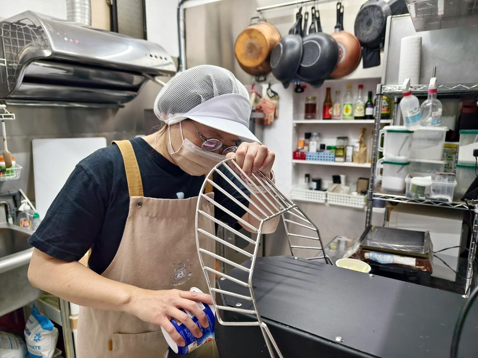 Professional chef preparing equipment in a kitchen